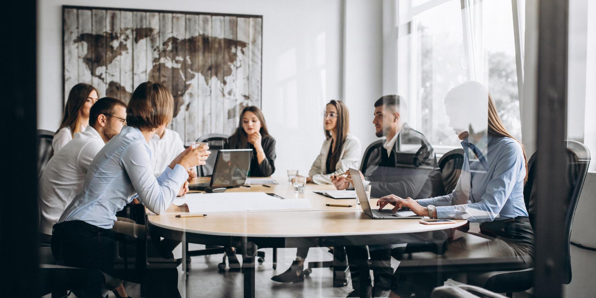 Group of people working out business plan in an office